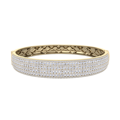 Diamond bangle in yellow gold with white diamonds of 6.97 ct in weight