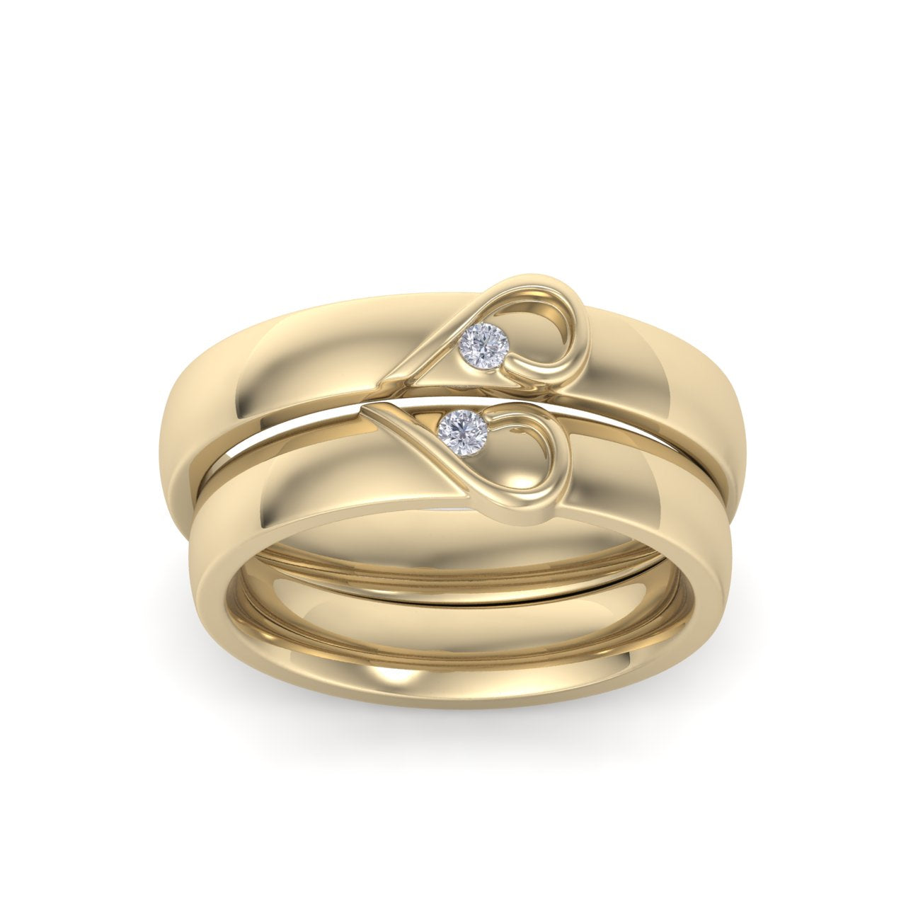 Couple rings with hearts in yellow gold with white diamonds of 0.06 ct in weight