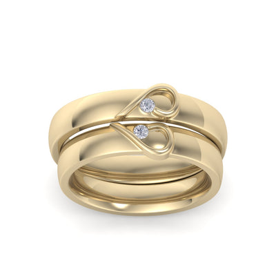 Couple rings with hearts in yellow gold with white diamonds of 0.06 ct in weight